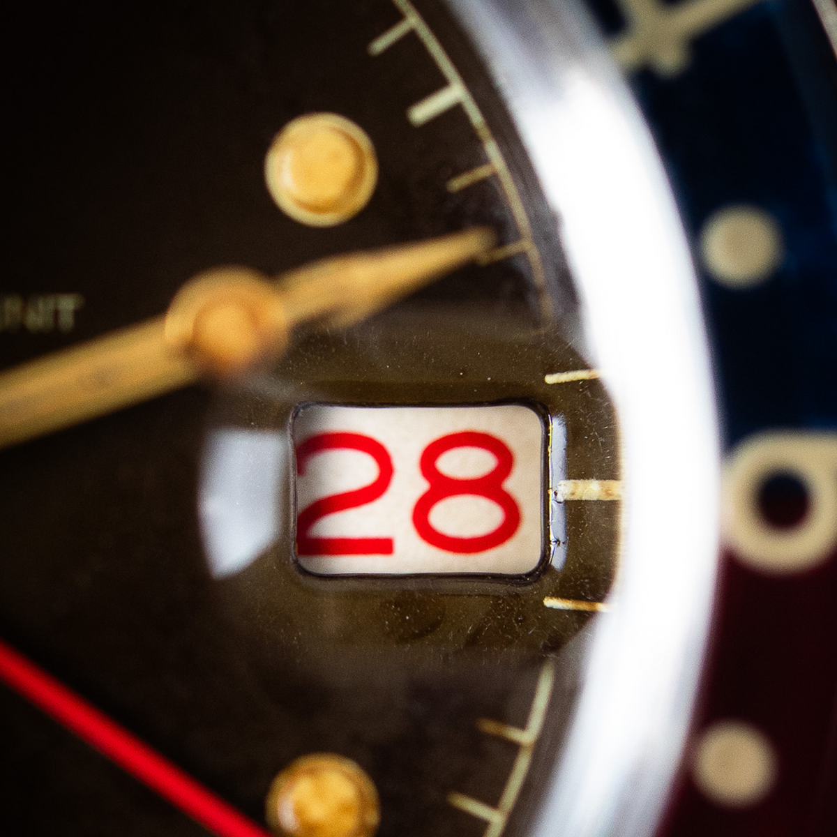 Macro close-up of WMT Panton MKII - Brown Dial/ Heavy Aged watch dial date window