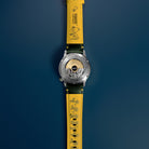 AVI-8 Peanuts Snoopy Limited Edition watch, Verdant Glow AV-4155-03, Back view showing open caseback and yellow lining of strap
