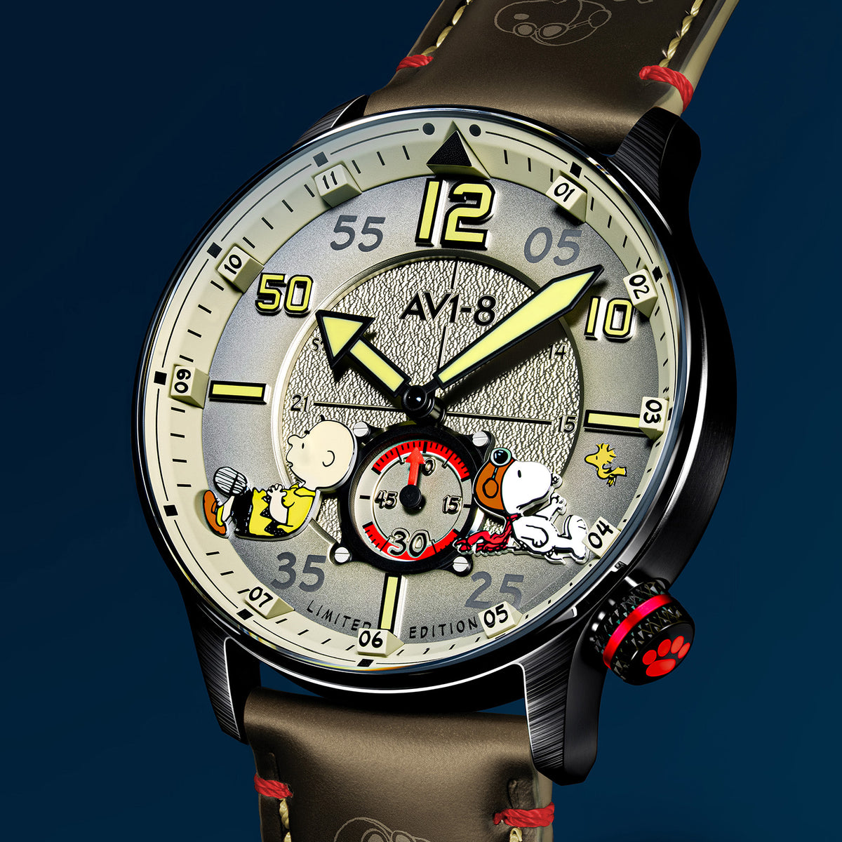 Close-up of AVI-8 Snoopy Limited Edition wristwatch featuring a sand dial with Charlie Brown, Snoopy and Woodstock cartoon characters
