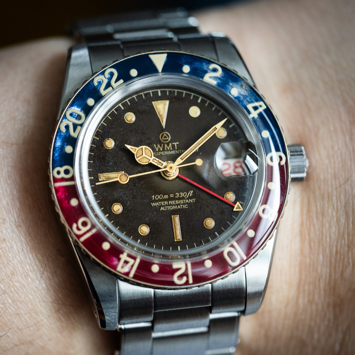 Wrist shot of WMT Panton MKII - Brown Dial/ Heavy Aged in metal bracelet